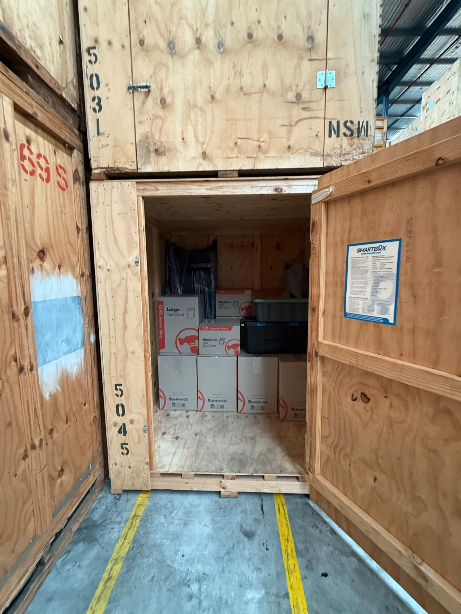 Boxes packed into a storage module by Mooove Removals