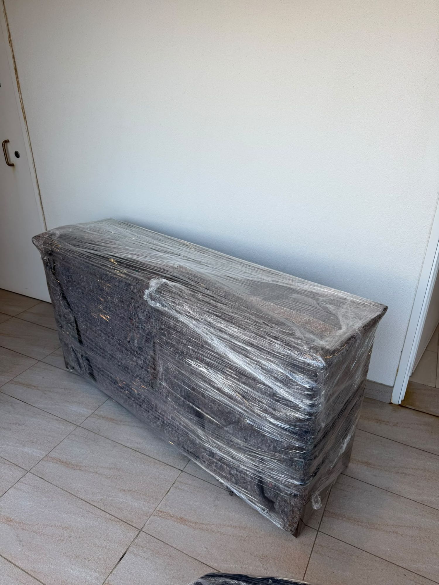 Sideboard blanket-wrapped for transport during a Sydney removal
